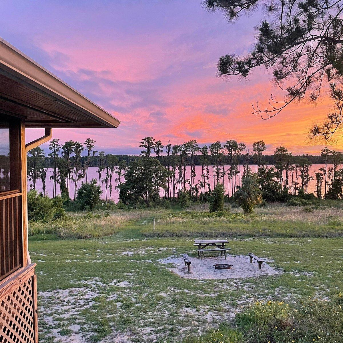 Sunset view from a cabin porch overlooking the lake